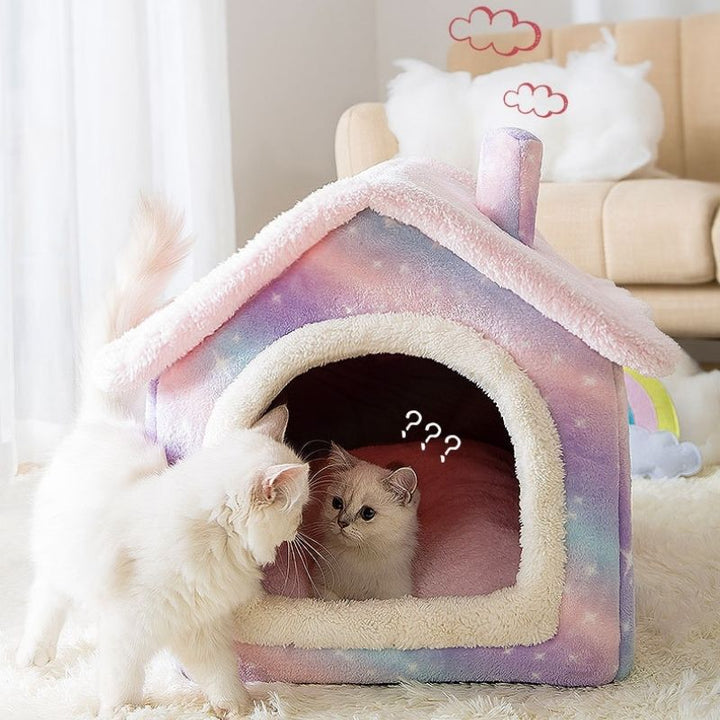 Acogedora casa para gatos de invierno